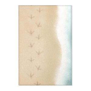 May include: A beach scene with a white foamy wave on the right side of the image. The left side of the image shows a sandy beach with a series of bird footprints leading up to the wave.