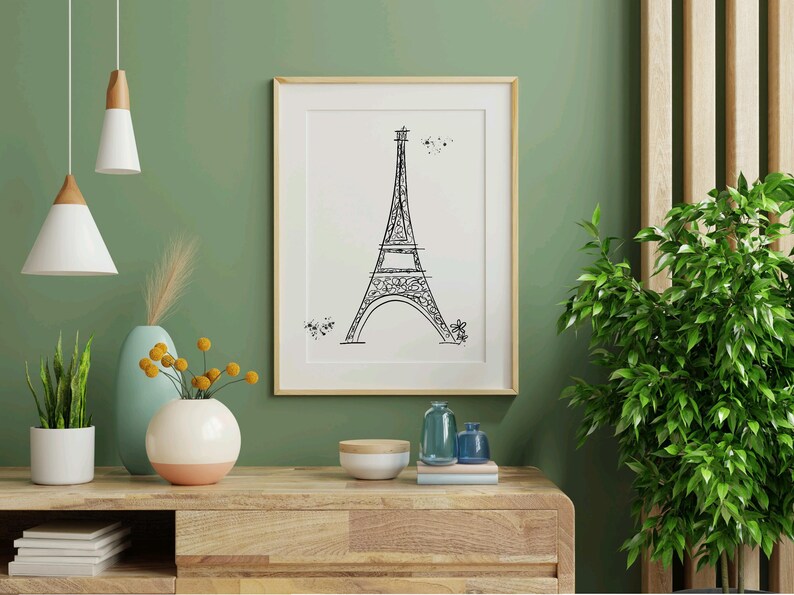 Three Paris inspired Eiffel Tower line art drawing in frame in entryway