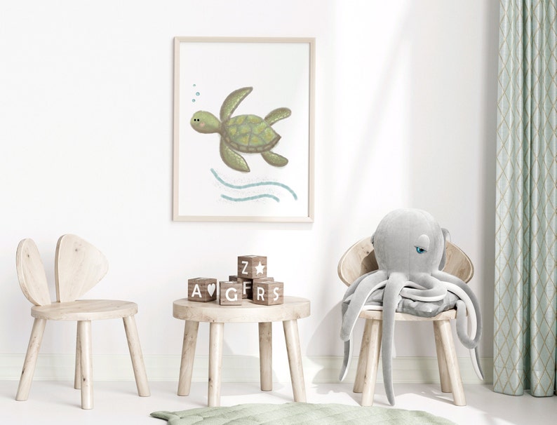A framed illustration of a sea turtle in a wooden frame on the wall in a child’s playroom with toys