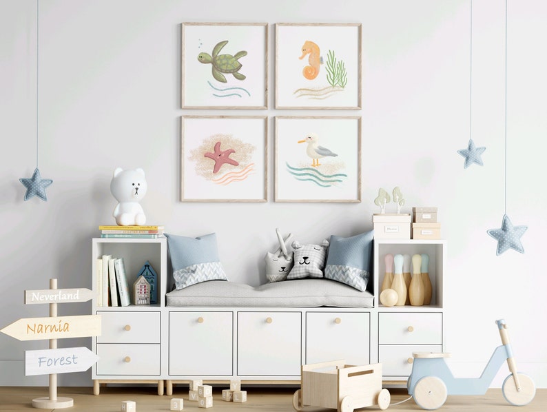 4 illustrations of sea turtle, sea horse, star fish, and seagull a wood frames hung on a wall in a children’s play room with toys
