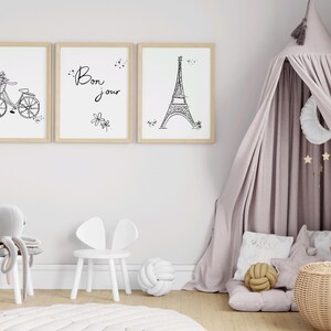 Three Paris inspired line art drawings in frames in little girl’s playroom
