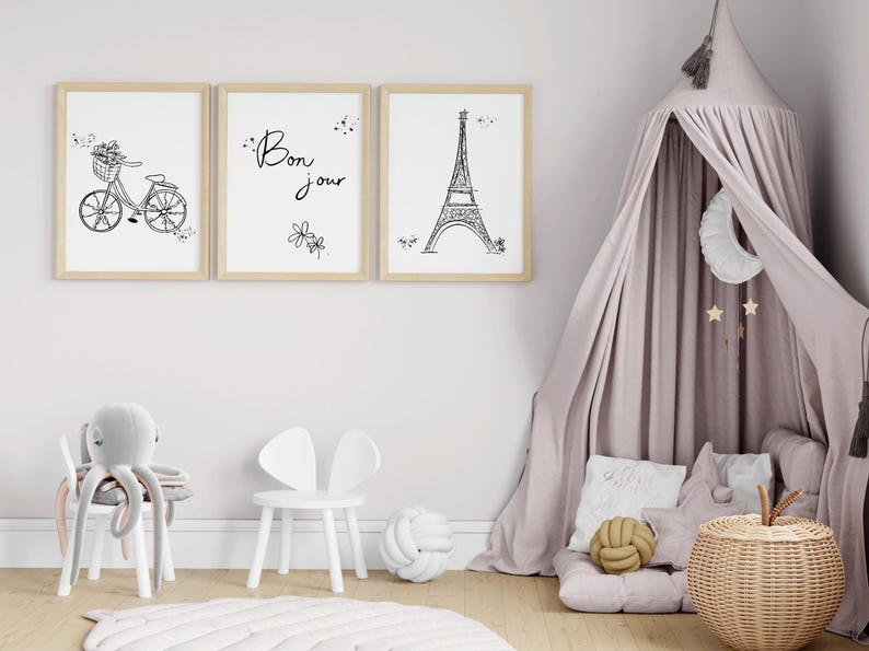 Three Paris inspired line art drawings in frames in little girl’s playroom