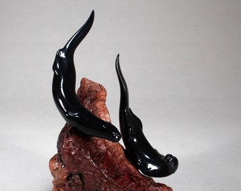 River Otter Duo Sculpture by John Perry on polished burlwood base. Signed.