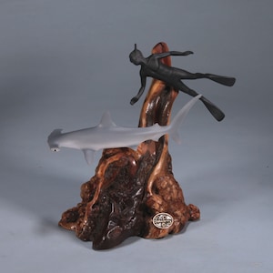 Hammerhead Shark and Diver by John Perry 7in tall Airbrushed on polished burlwood base. Signed.