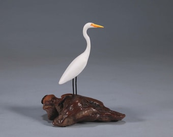 Egret by John Perry 5 inches tall on polished burlwood base. Signed.