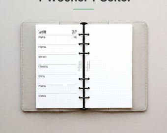 May include: An open ring-bound planner with a light gray cover. The left page shows a weekly schedule for January 2027 with German text, while the right page is a blank dot grid. The text 1 Woche. 1 Seite. appears above the planner.