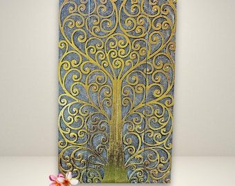 May include: A wooden wall art piece featuring a gold tree of life design with intricate swirls and branches. The background is a dark gray color.