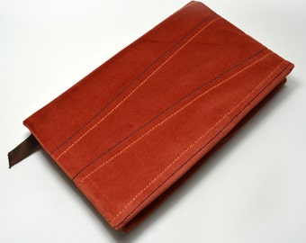 Adjustable velvet notebook cover in brown.