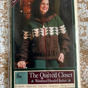 May include: A package for a Woodland Hooded Jacket sewing pattern. The jacket is quilted with a green, brown, and white design. The package has the text "The Quilted Closet" and "Hooded Jacket #101". Sizes available are Small 6-8 to XX-Large 22-24.