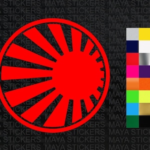 May include: Red vinyl sticker with a stylized sunburst design. The sunburst is a circle with rays emanating from the center. The sticker is perfect for adding a touch of style to any surface.