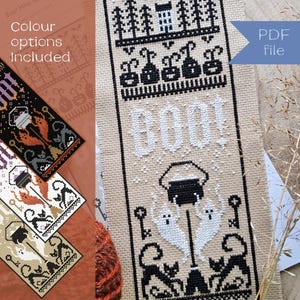 May include: A cross-stitch pattern with a Halloween theme, featuring the word "BOO!" in white, along with black and white images of ghosts, cats, and a cauldron. The design includes the text "Stitch this design in black and white, or on pale or dark fabrics."