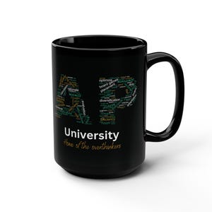 May include: Black coffee mug with a white word cloud design that spells out "AP" and the text "University Home of the overthinkers".