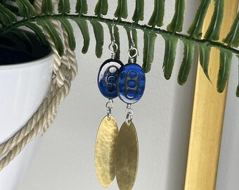 Hammered raw brass earrings with dark blue glass bead.