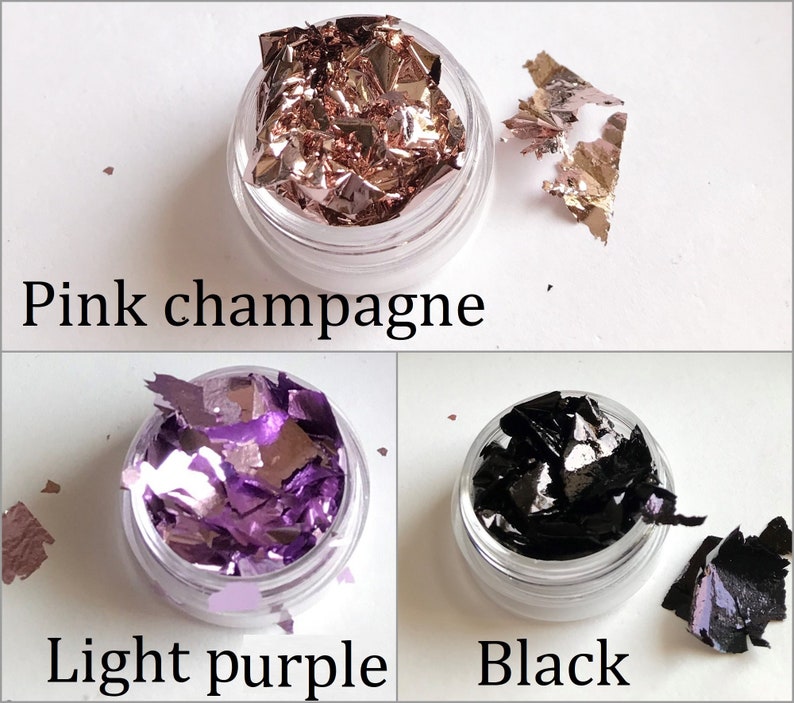 May include: Three small jars of loose metallic flakes. The jars are labeled "Pink champagne", "Light purple", and "Black".