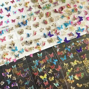 May include: A sheet of clear nail stickers with colorful butterfly designs. The stickers are arranged in rows and columns, with each butterfly design unique. The stickers are perfect for adding a touch of whimsy to your nails.
