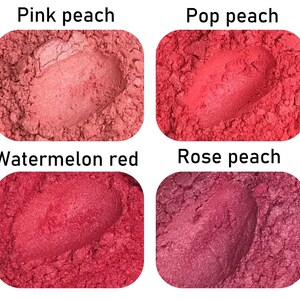 May include: Four samples of mica powder in shades of pink and red. The colours are labelled "Pink peach", "Pop peach", "Watermelon red", and "Rose peach".