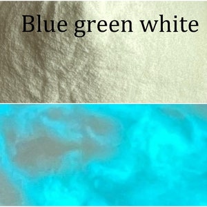 May include: A close-up of a white powder that glows blue-green under a black light. The powder is labeled "Blue green white".