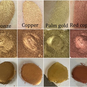 K&ouml;nnte beinhalten: Eine Sammlung metallischer Lidschatten-Swatches in Bronze, Kupfer, Palm Gold und Rotkupfer. Das Bild zeigt den Lidschatten in verschiedenen Formen, einschlie&szlig;lich Puder und Creme, mit den Namen jeder Farbe darunter.