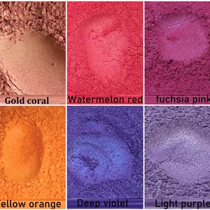 May include: Six small containers of loose pigment powder in various colours, including gold coral, watermelon red, fuchsia pink, yellow orange, deep violet, and light purple.
