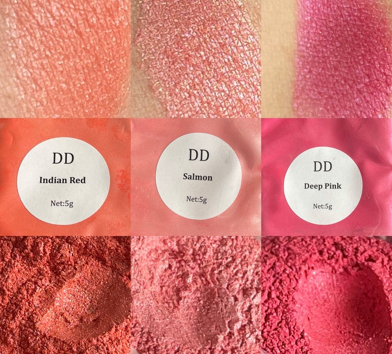 May include: Three small jars of loose powder pigment in shades of red, pink, and orange. The jars are labeled with the text "DD" and the names of the colors: "Indian Red", "Salmon", and "Deep Pink". Each jar contains 5 grams of pigment.