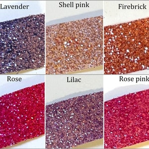 May include: Six small jars of glitter, each with a different color. The colors are lavender, shell pink, firebrick, rose, lilac, and rose pink.