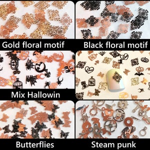 May include: Assortment of nail art embellishments in four different themes: gold floral motif, black floral motif, mix Halloween, and steampunk. The embellishments are made of metal and are in various shapes and sizes.