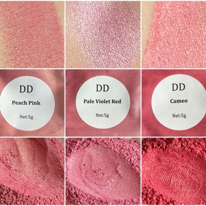 May include: Three small jars of loose cosmetic pigment powder. The jars are labeled "DD Peach Pink", "DD Pale Violet Red", and "DD Cameo". Each jar contains 5 grams of pigment.