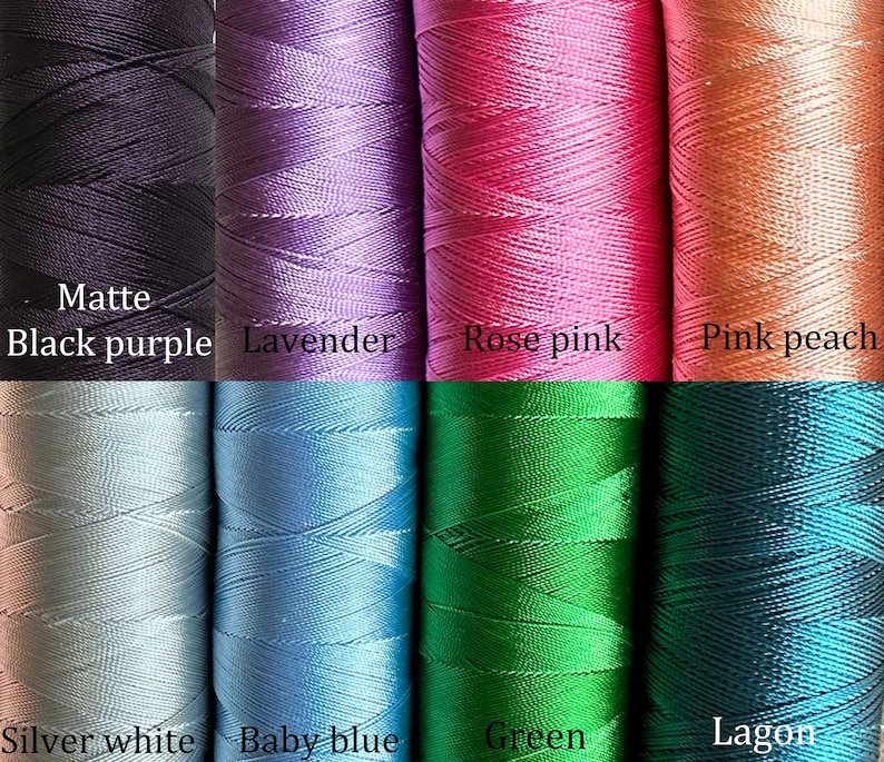 May include: Eight spools of embroidery floss in various colors, including matte black purple, lavender, rose pink, pink peach, silver white, baby blue, green, and lagoon.