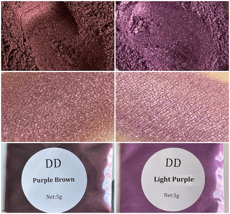 May include: Two small jars of loose eyeshadow pigment. The jar on the left is labeled "DD Purple Brown Net: 5g" and the jar on the right is labeled "DD Light Purple Net: 5g".