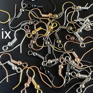 May include: A mix of silver, gold, and rose gold earring hooks with spring-loaded clasps. The hooks are all the same size and shape, but they have different finishes.