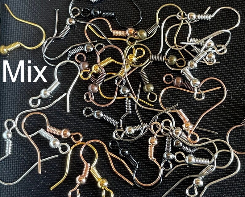 May include: A mix of silver, gold, and rose gold earring hooks with spring-loaded clasps. The hooks are all the same size and shape, but they have different finishes.