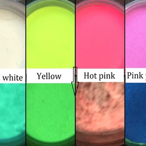 May include: Four small jars of glow-in-the-dark sand. The jars are labeled "Green white", "Yellow", "Hot pink", and "Pink purple".