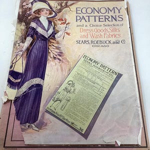 May include: Vintage advertisement for "Economy Patterns" by Sears, Roebuck and Co. The illustration features a woman in a purple dress and hat. The ad promotes dress goods, silks, and wash fabrics. The text includes "Chicago" and a price.