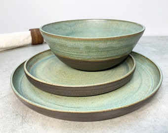 Made to order three piece black stoneware table setting in matte aqua