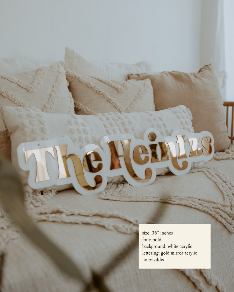 Last Name Sign shown in white and gold mirror acrylic.