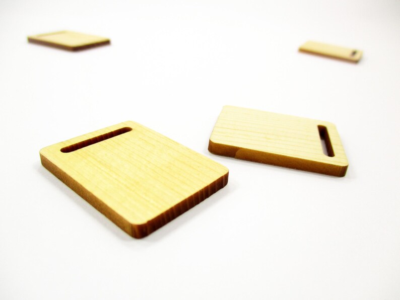 Realistic 1:12 scale miniature wooden cutting boards for bakery displays, handcrafted with natural wood grain for dioramas.