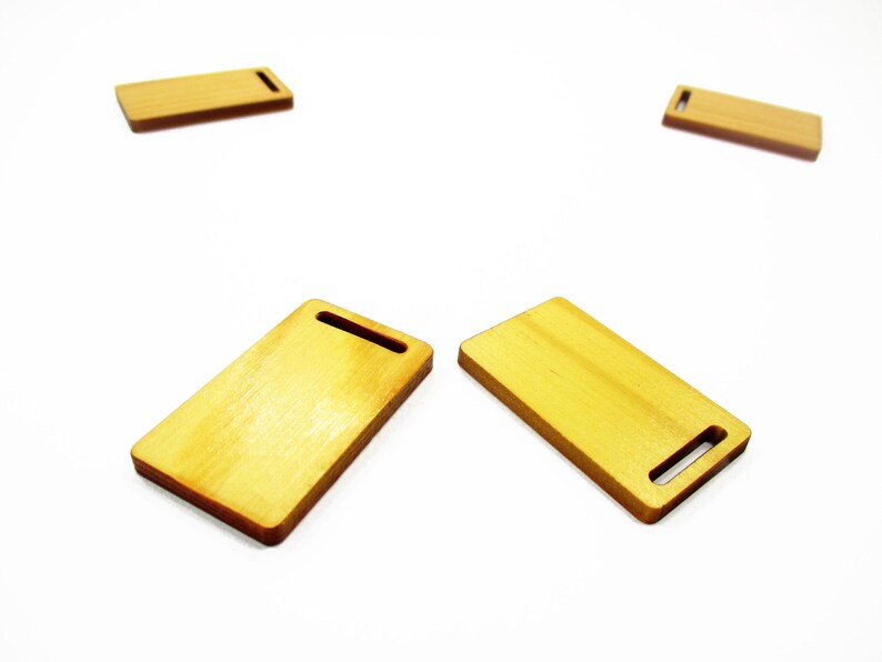 Set of two handcrafted 1:12 scale miniature long wooden cutting boards, size 23x38mm, for dollhouse kitchen display scenes.