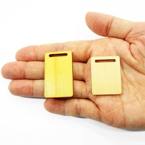 Handcrafted 1:12 scale miniature wooden cutting boards in both 30x23mm and 23x38mm sizes shown on an adult palm for display.