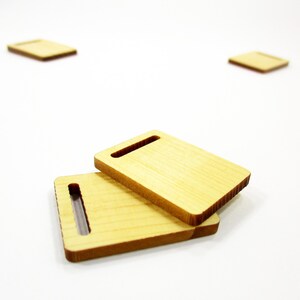 Two stacked handcrafted 1:12 scale miniature wooden boards, essential props for room box kitchen counters and miniature cafes.