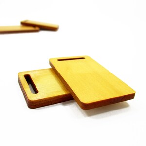 Stacked handcrafted 1:12 scale miniature rectangular wood boards, perfect props for bakery dioramas and miniature food prep.