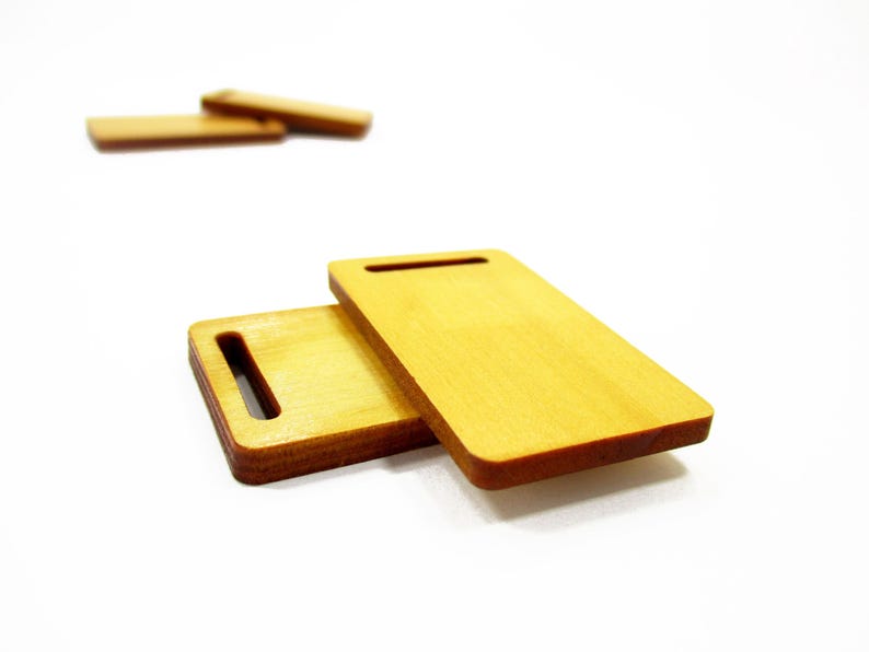 Stacked handcrafted 1:12 scale miniature rectangular wood boards, perfect props for bakery dioramas and miniature food prep.
