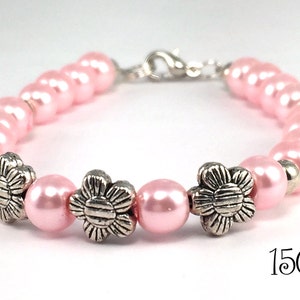 Pink pearls and flowers make a pretty statement for your wrist
