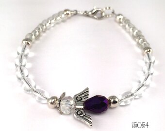A pretty purple guardian angel is the centerpiece of this smooth clear glass beaded stacking bracelet