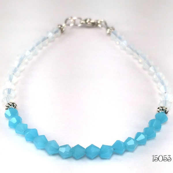 Simply lovely beaded bracelet made of faceted crystals of milky light blue and milky white, perfect for both casual and dressy stacking