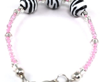 Black and white zebra striped beads with pink and clear glass seed beads stacking bracelet