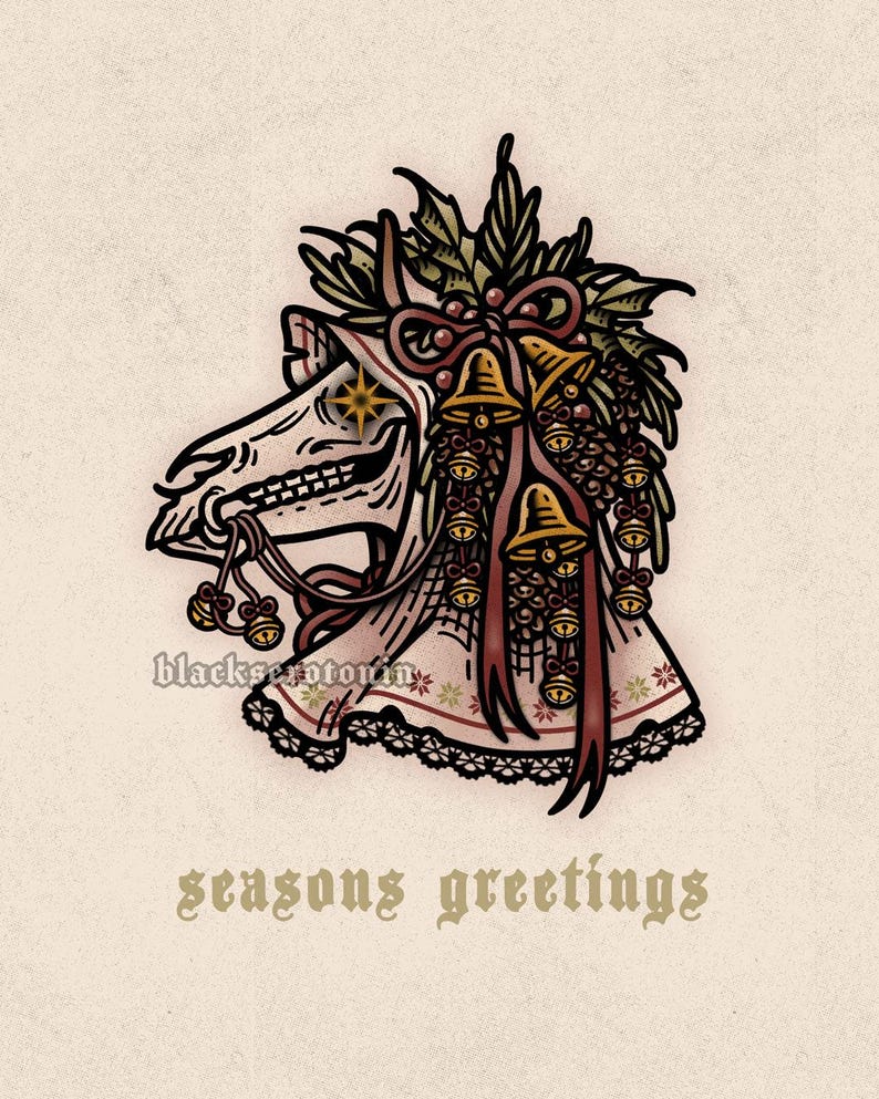 May include: A graphic illustration of a skeletal animal head wearing a bonnet adorned with holly, pinecones, and gold bells. The text blackserotonin appears near the neck, and the text seasons greetings is printed in a gothic font below the image.