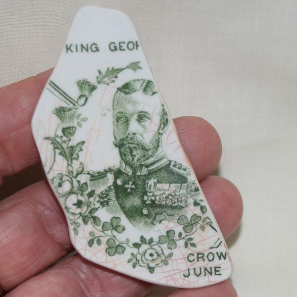 King George V pottery shard pendant, jewellery, found on the shore of the river Thames.