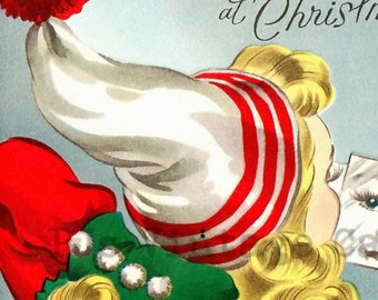 Vintage Weihnachtskarte digitaldownload Bild hübsche 40er Jahre Mädchen grün Handschuhe rot weiß Hut blond Lady sieht im Spiegel