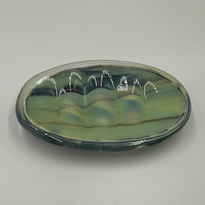Oval fused glass soap dish in hues of gray, blue, brown, cream