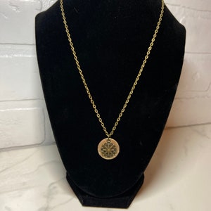 Lovely antique brass necklace with custom brass hammered circular charm with compass themed charm